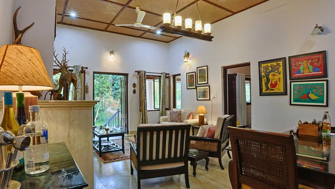 The Bungalow's living room with antlers, period furniture and paintings