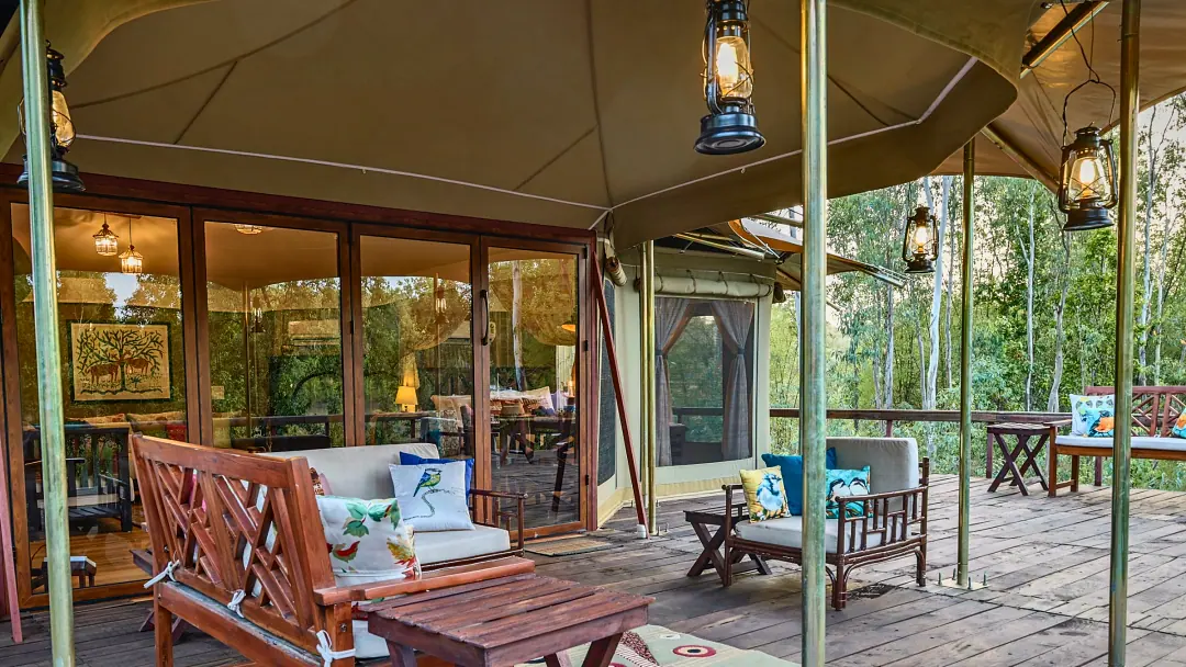 The Chief's Tent veranda with lanterns and garden furniture