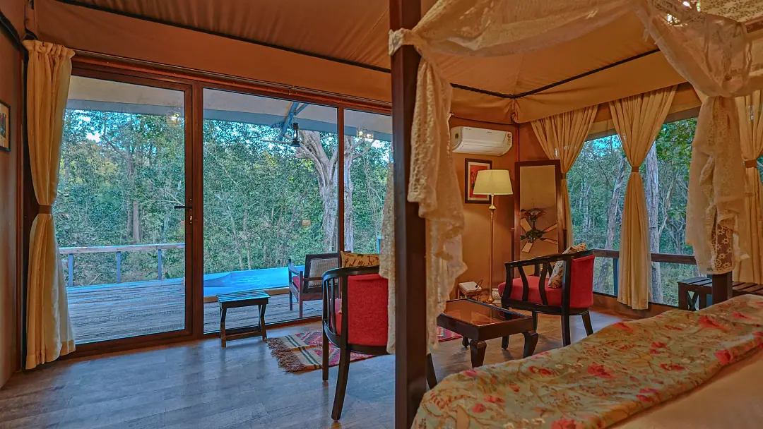 Glass doors from the King's Tent bedroom onto the deck and pool
