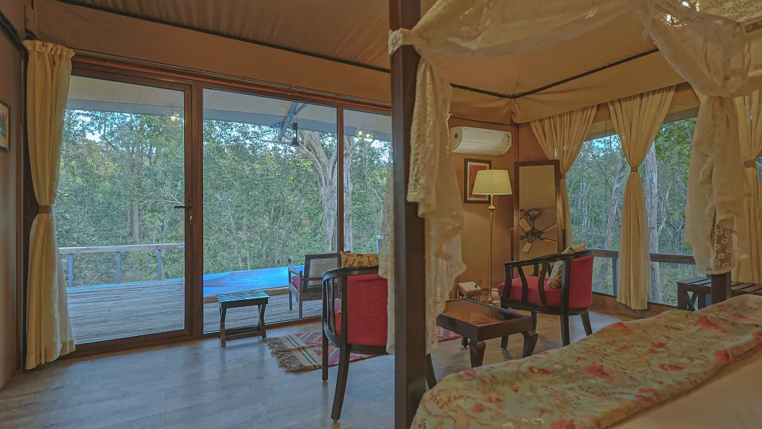 Glass doors from the King's Tent bedroom onto the deck and plunge pool