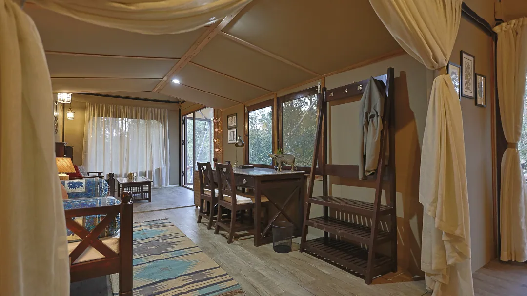 The length of the King's Tent: dining table, writing desk and wardrobe beneath the canvas