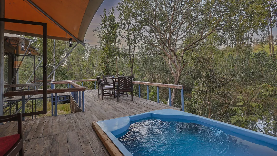 The King's Tent's private plunge pool on its deck above the forest